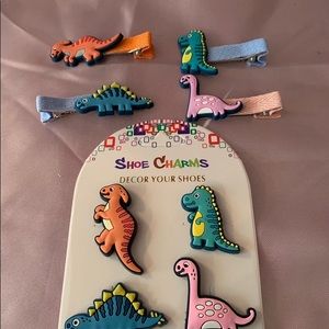 Dinosaur hair clips and shoes charms. Let me know which set you want